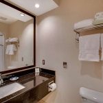 bathroom vanity in hotel room at Best Western Plus The Inn at Hampton